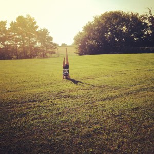 Alexa Tomaszewski practices her pike headstand in the Kawartha Lakes at Double M RV Resort and Campground